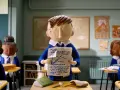 Bambini in aula con un foglio che mostra un grafico. Il cortometraggio significato è la difficoltà di apprendimento.