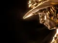 Statua dorata di un giovane con cappello, un premio David di Donatello per il miglior cortometraggio.