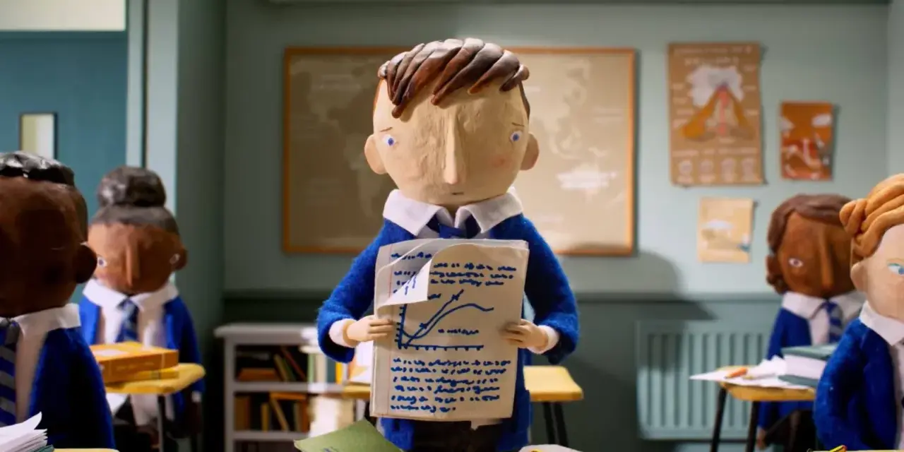 Bambini in aula con un foglio che mostra un grafico. Il cortometraggio significato è la difficoltà di apprendimento.